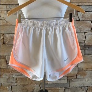 White Nike running shorts